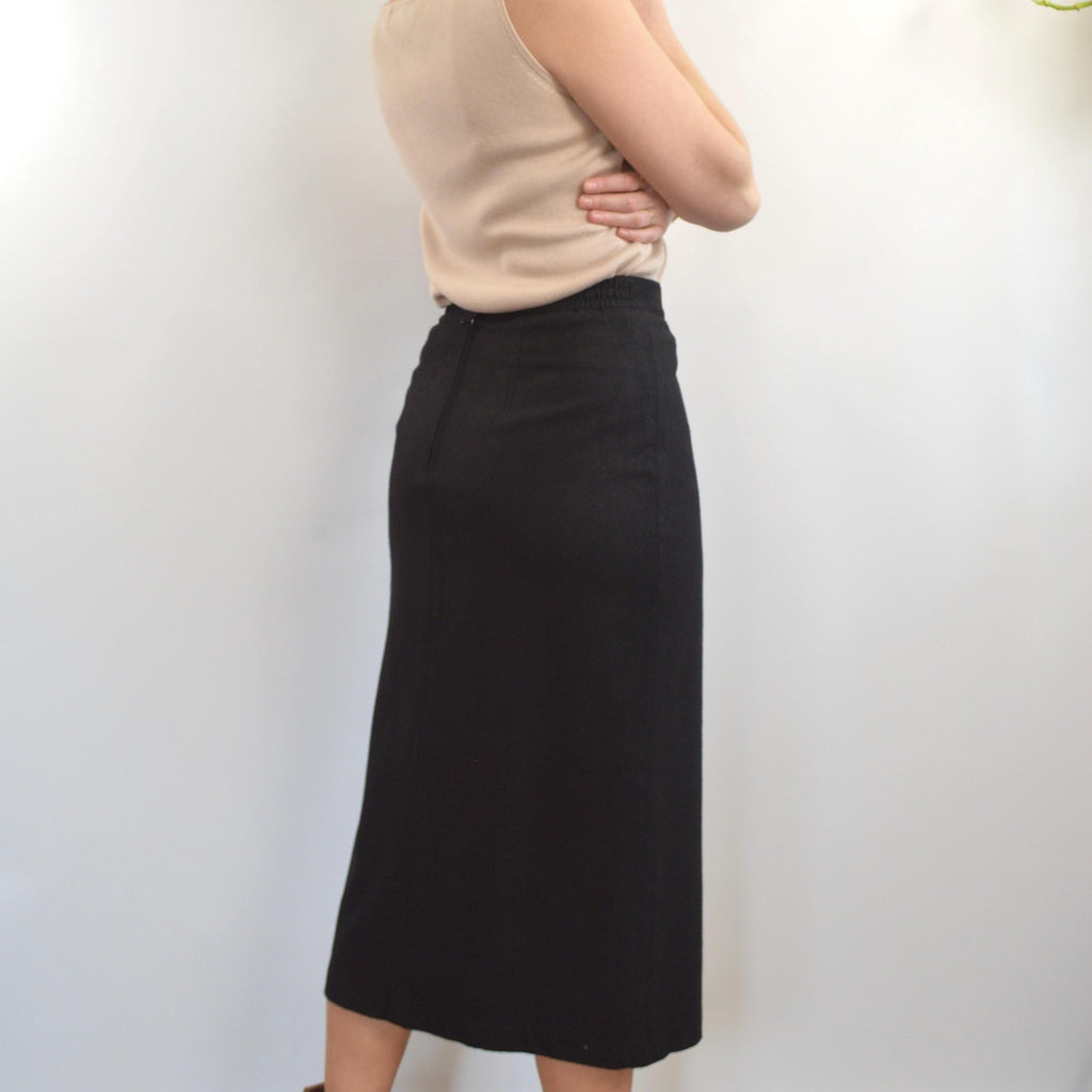 medium black wool midi skirt with off center front slit and full lining