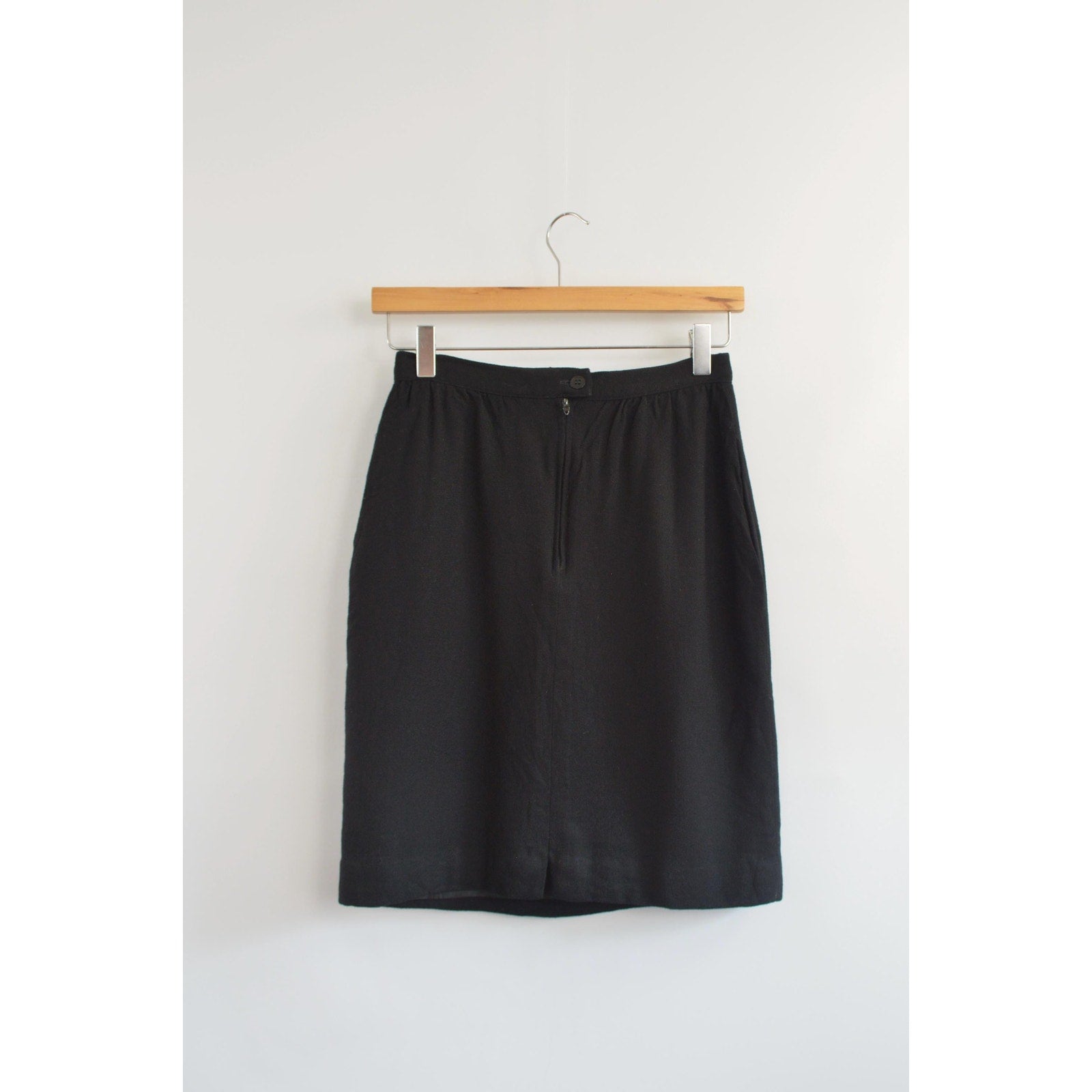 fully lined knee length black wool skirt with pockets