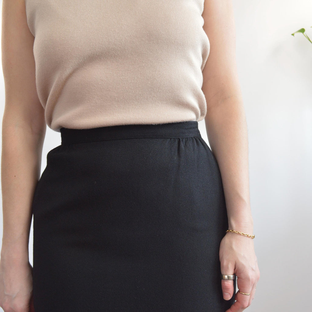 fully lined knee length black wool skirt with pockets
