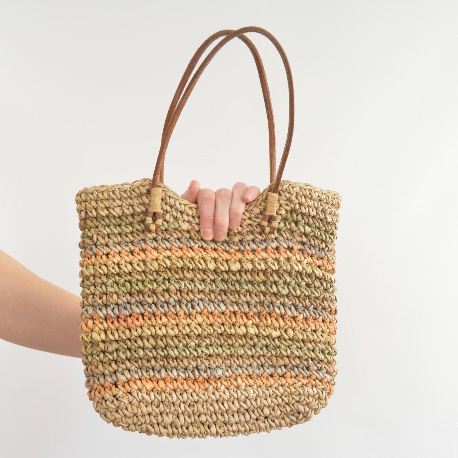 olive, blue and peach striped straw bag with leather handles