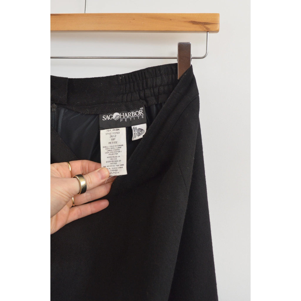 medium black wool midi skirt with off center front slit and full lining