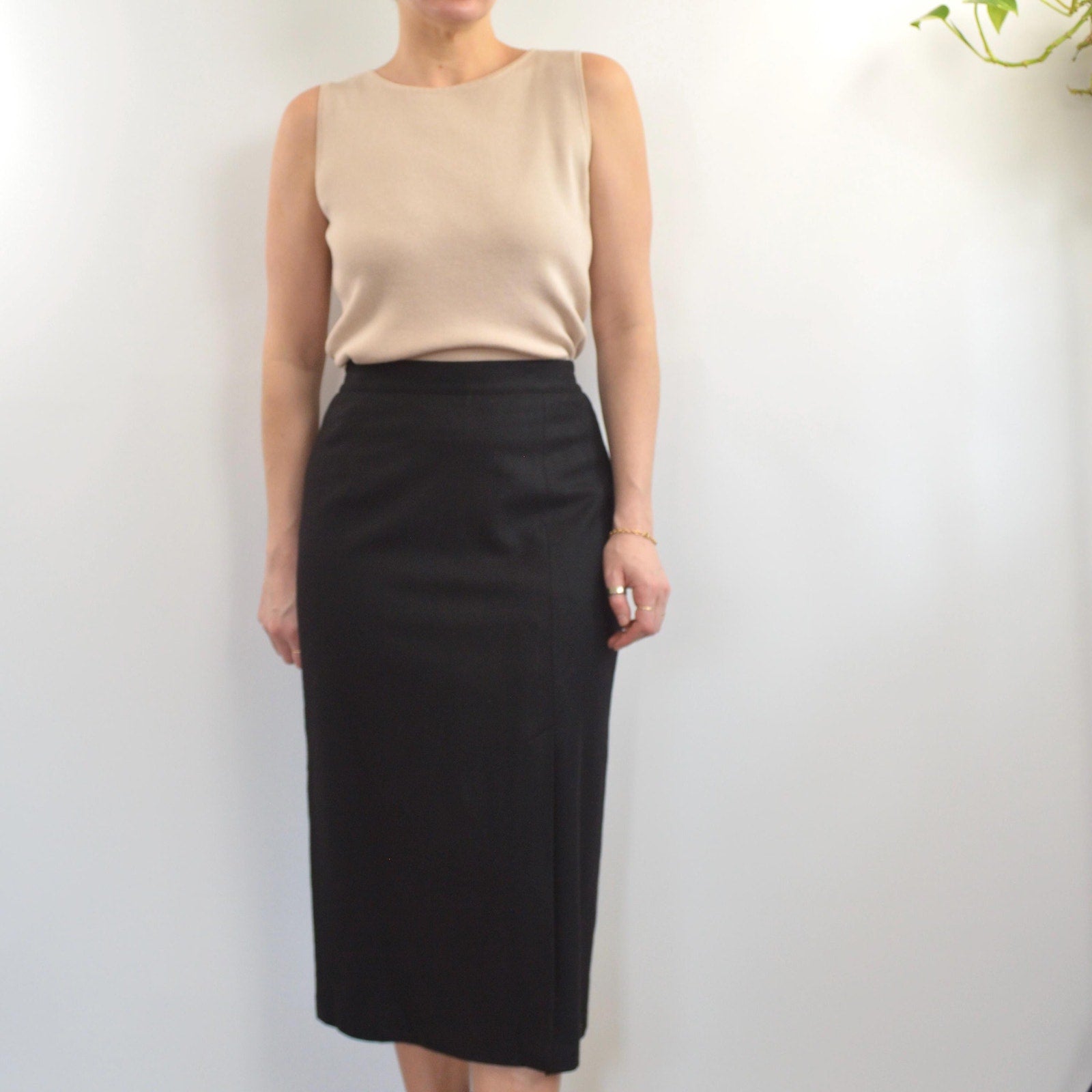 medium black wool midi skirt with off center front slit and full lining