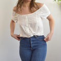 white vintage eyelet off the shoulder button down crop blouse