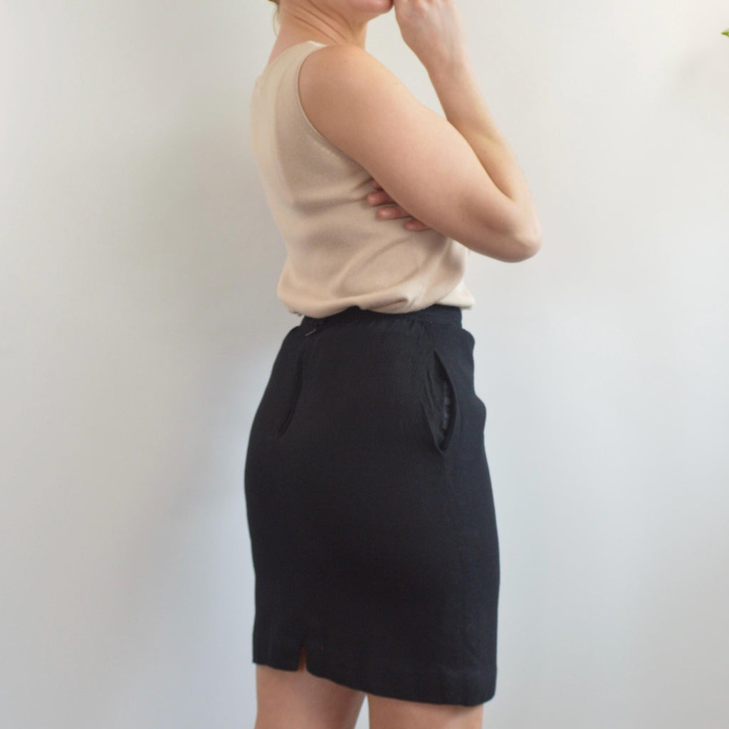 fully lined knee length black wool skirt with pockets