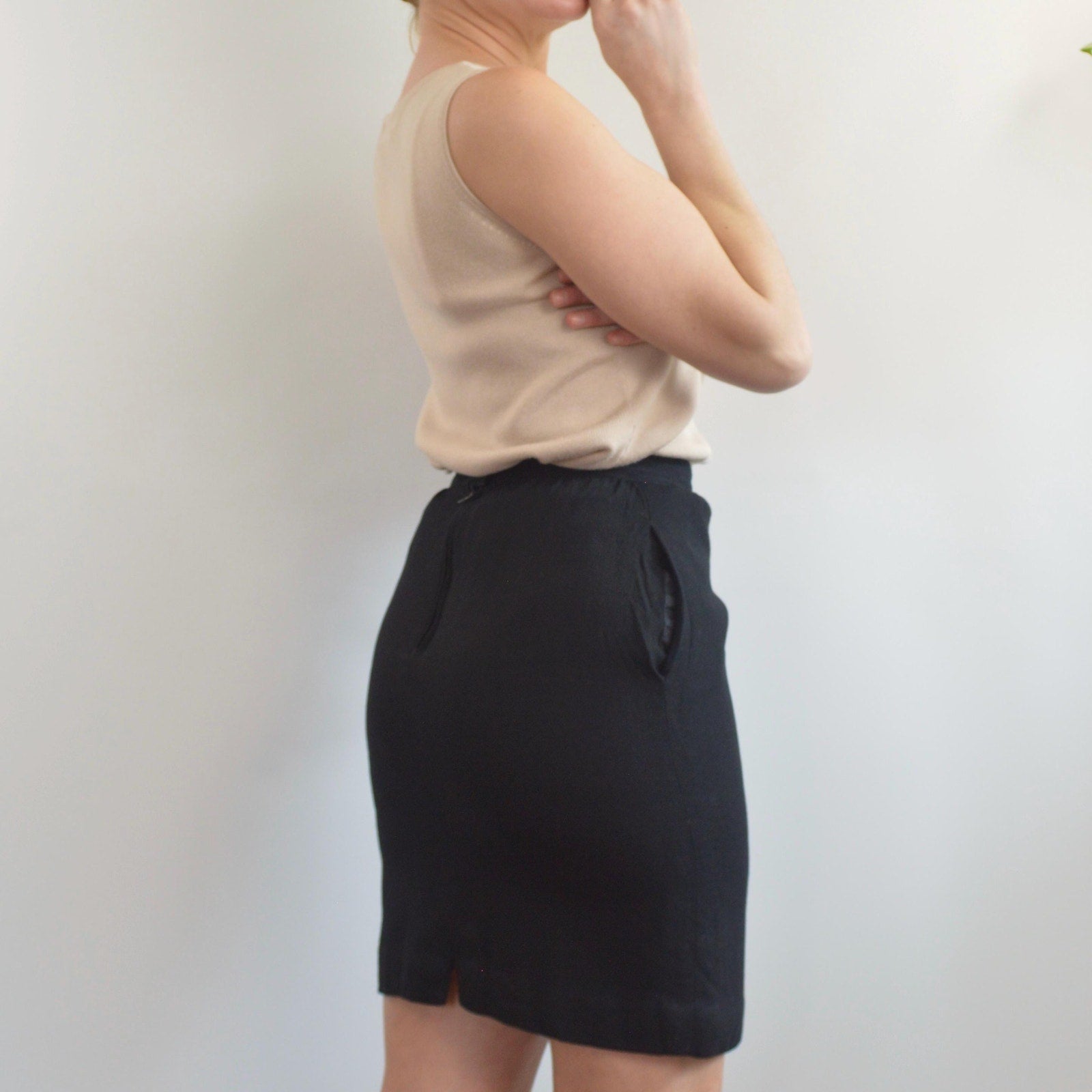 fully lined knee length black wool skirt with pockets