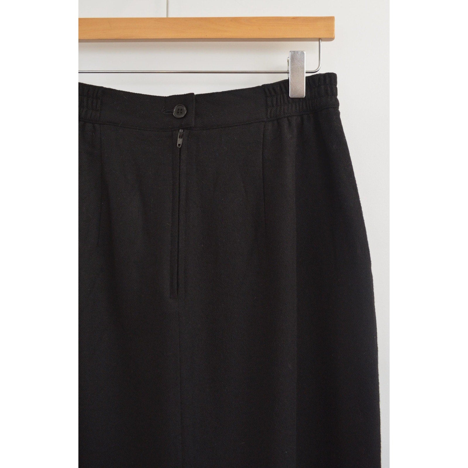 medium black wool midi skirt with off center front slit and full lining